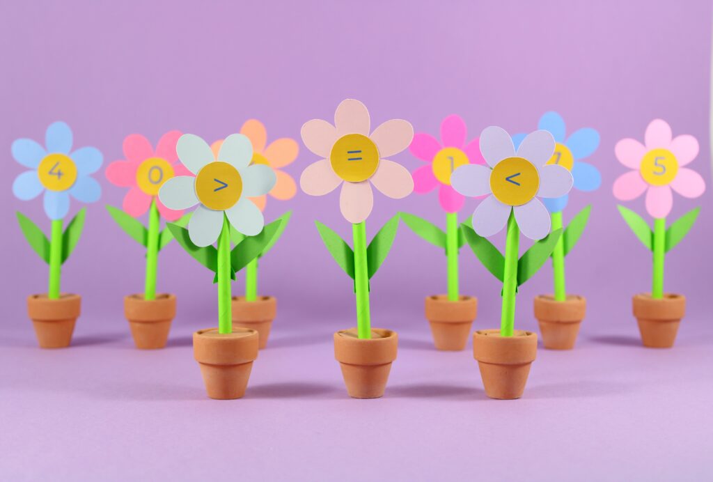 Number Flowers in plant pots in a row 