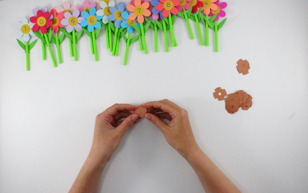 Folding score lines on number flower pot lid